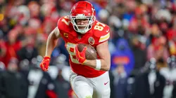 Travis Kelce #87 of the Kansas City Chiefs runs for yardage after a third quarter pass catch in the Divisional Round playoff at GEHA Field at Arrowhead Stadium on January 18, 2025.