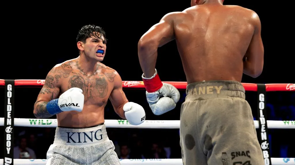 Ryan Garcia (white trunks) reacts against Devin Haney (gray trunks) during their WBC Super Lightweight title bout. (Photo by Al Bello/Getty Images)