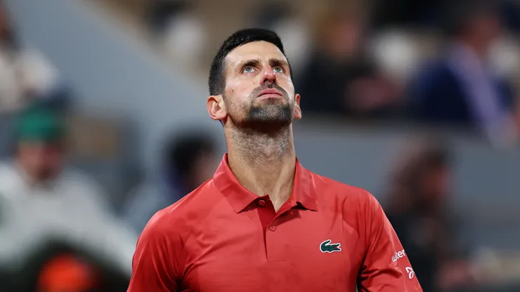 Novak Djokovic of Serbia reacts against Lorenzo Musetti of Italy in the Men's Singles third round match at Roland Garros.