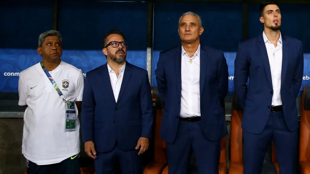 Cleber Xavier (2ndL) and Tite (3rdL) look on prior to the Copa America Brazil 2019 quarterfinal match between Brazil and Paraguay