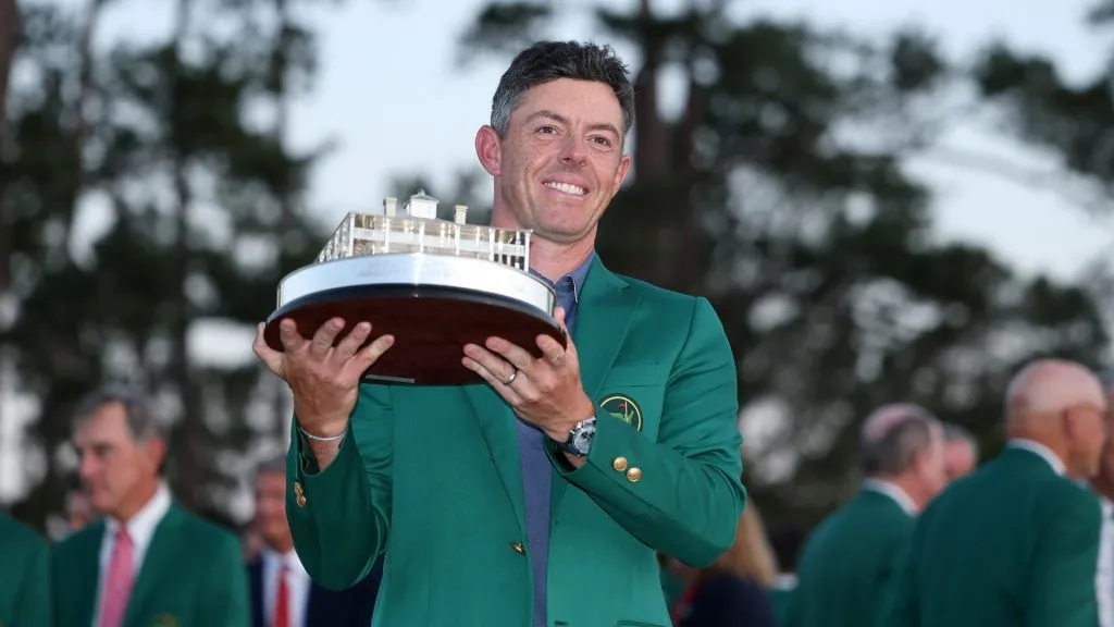 Rory McIlroy of Northern Ireland poses with the Masters trophy during the Green Jacket Ceremony after winning the 2025 Masters Tournament at Augusta National Golf Club. (Source: Richard Heathcote/Getty Images)