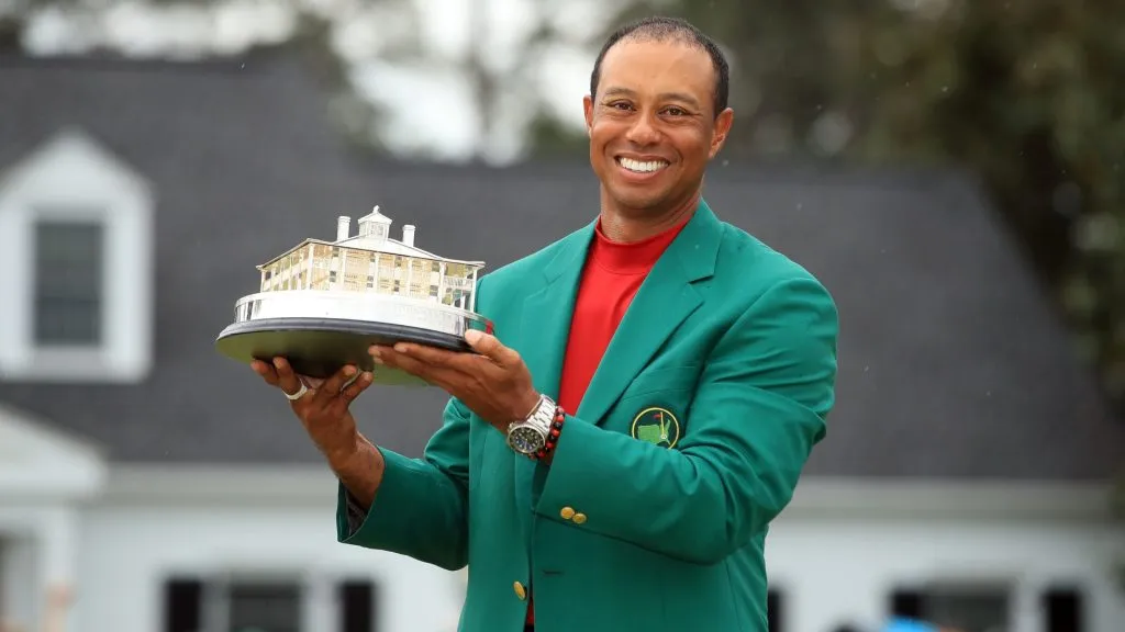 Tiger Woods of the United States celebrates with the Masters Trophy during the Green Jacket Ceremony after winning the Masters at Augusta National Golf Club on April 14, 2019. (Source: Andrew Redington/Getty Images)