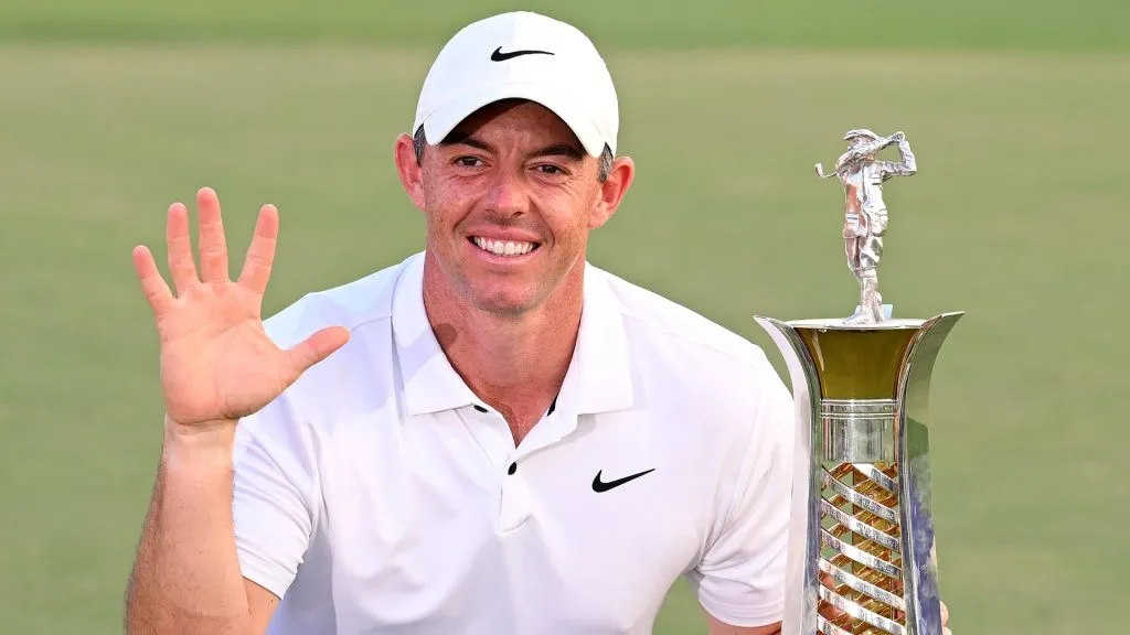 Rory McIlroy of Northern Ireland poses with the Race to Dubai trophy on the 18th green during Day Four of the DP World Tour Championship on the Earth Course in 2023. (Source: Ross Kinnaird/Getty Images)