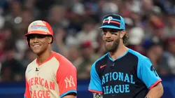 Former Yankees' Juan speaks with Bryce Harper #3 of the Philadelphia Phillies at first base during the 94th MLB All-Star Game presented by Mastercard at Globe Life Field on July 16, 2024 in Arlington, Texas.