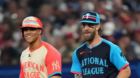 Former Yankees' Juan speaks with Bryce Harper #3 of the Philadelphia Phillies at first base during the 94th MLB All-Star Game presented by Mastercard at Globe Life Field on July 16, 2024 in Arlington, Texas.