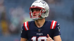 Drake Maye of the Patriots looks on before a game.