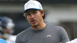 Head coach Jim Harbaugh and Justin Herbert #10 of the Los Angeles Chargers talk before a preseason game against the Seattle Seahawks at SoFi Stadium on August 10, 2024 in Inglewood, California.