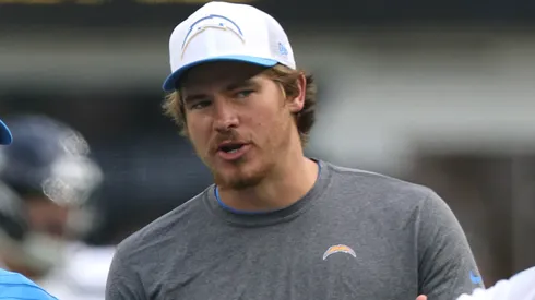 Head coach Jim Harbaugh and Justin Herbert #10 of the Los Angeles Chargers talk before a preseason game against the Seattle Seahawks at SoFi Stadium on August 10, 2024 in Inglewood, California.
