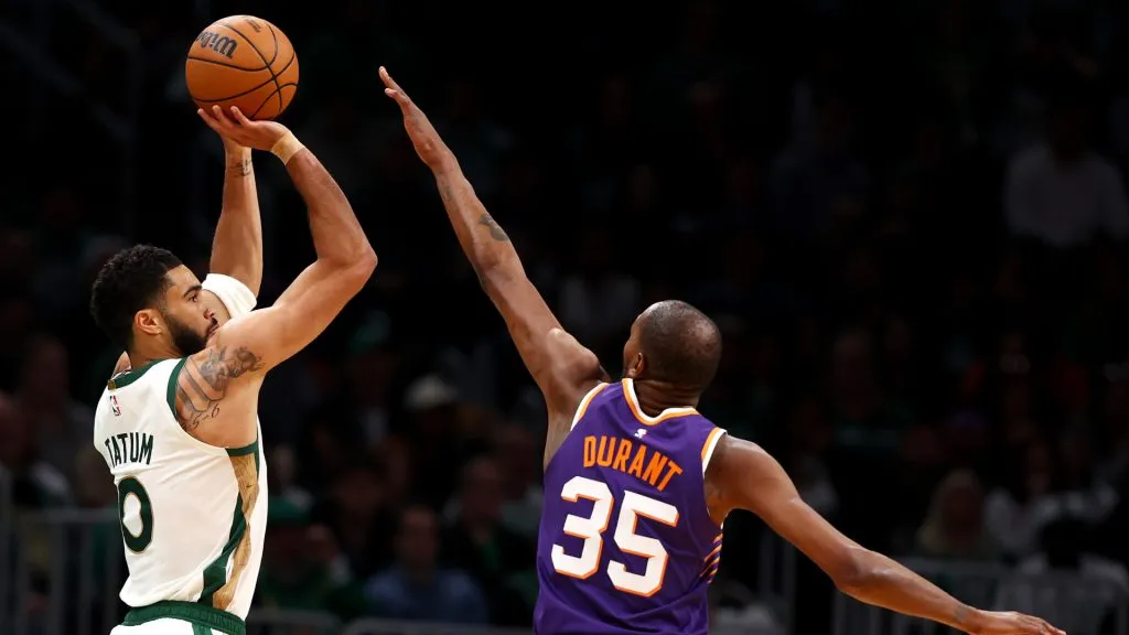 Jayson Tatum #0 of the Boston Celtics shoots against Kevin Durant #35 of the Phoenix Suns during the second quarter at TD Garden. (Maddie Meyer/Getty Images)