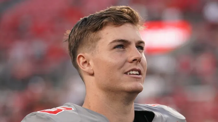 Will Howard #18 of the Ohio State Buckeyes walks off the field after the game against the Iowa Hawkeyes at Ohio Stadium on October 05, 2024 in Columbus, Ohio.