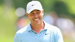 Brooks Koepka of the United States smiles on the second green during a practice round prior to the 2024 PGA Championship at Valhalla Golf Club on May 13, 2024.