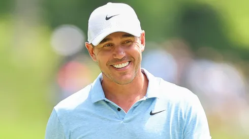Brooks Koepka of the United States smiles on the second green during a practice round prior to the 2024 PGA Championship at Valhalla Golf Club on May 13, 2024.