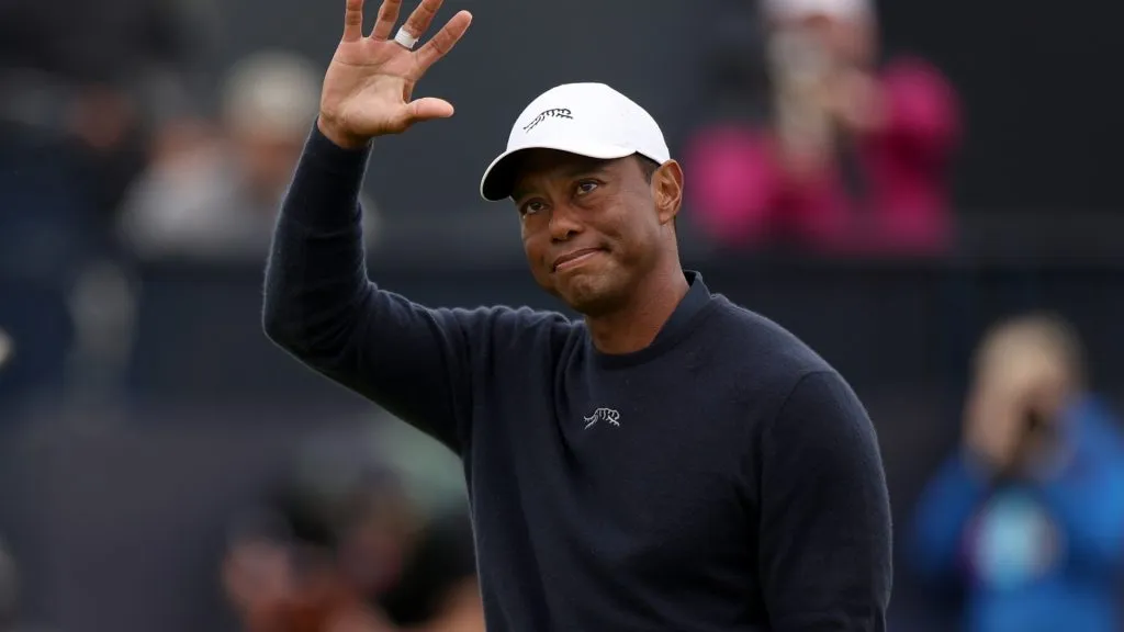 Tiger Woods of the United States acknowledges the crowd as he walks off the 18th green after finishing his round during day two of The 152nd Open championship on July 19, 2024. (Source: Harry How/Getty Images)
