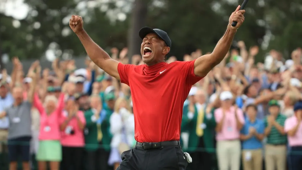 Tiger Woods of the United States celebrates on the 18th green after winning the Masters at Augusta National Golf Club on April 14, 2019. (Source: Andrew Redington/Getty Images)