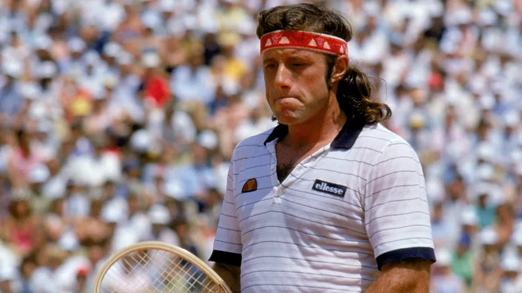 Guillermo Vilas of Argentina stands on the tennis court during a match in the 1982 French Open. (Steve Powell/Getty Images)