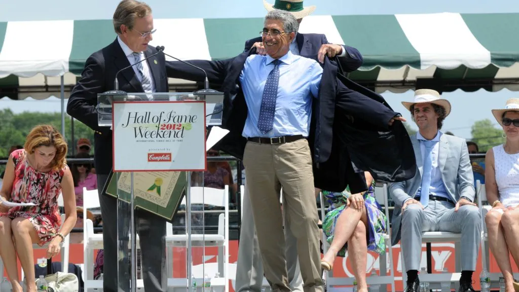 Manuel Orantes receives his blue blazer after being inducted into the International Tennis Hall Of Fame. (Darren McCollester/Getty Images)