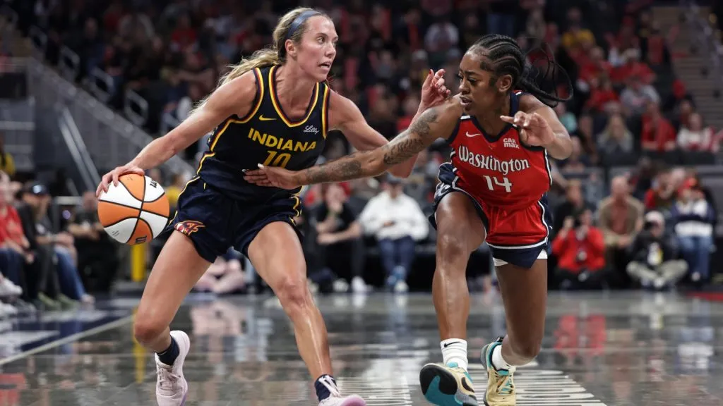 Lexie Hull #10 of the Indiana Fever dribbles past Zaay Green #14 of the Washington Mystics during the second half at Gainbridge Fieldhouse on May 3, 2025. (Source: Geoff Stellfox/Getty Images)
