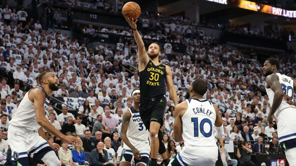 Stephen Curry takes a shot against Mike Conley during the first quarter in Game One of the Western Conference Second Round NBA Playoffs.