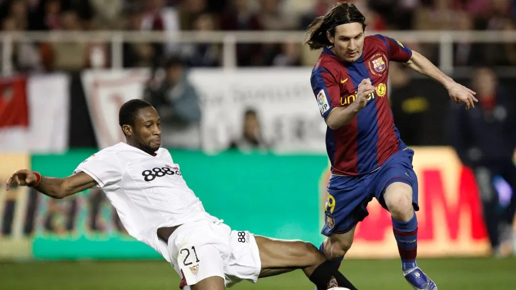 Seydou Keita (L) of Sevilla fowls Lionel Messi of Barcelona during the La Liga match between Sevilla and Barcelona. (Jasper Juinen/Getty Images)