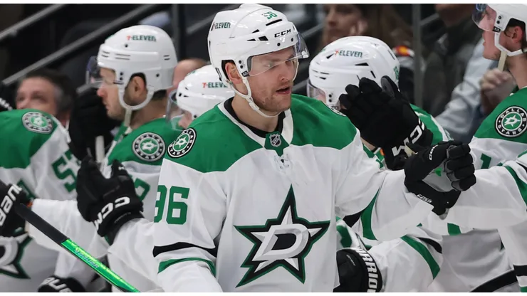 Mikko Rantanen #96 of the Dallas Stars celebrates with teammates after scoring a goal.