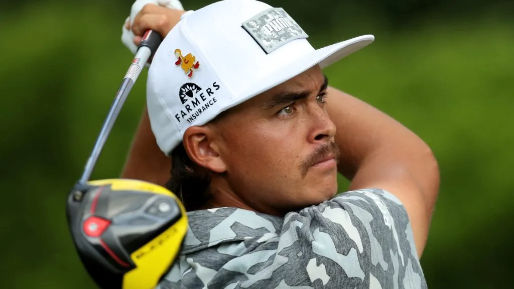 Rickie Fowler plays his shot from the 12th tee during round three of the Rocket Mortgage Classic at the Detroit Country Club on June 29, 2019. (Source: Gregory Shamus/Getty Images)