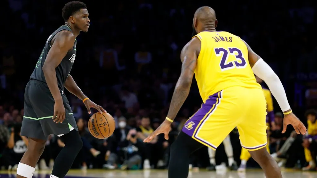 Anthony Edwards #5 dribbles in front of LeBron James #23 of the Los Angeles Lakers during a 103-96 Timberwolves win in Game Five of the playoffs. (Harry How/Getty Images)