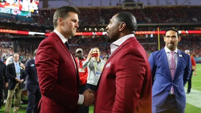Tom Brady of the New England Patriots talks with NFL Hall of Famer Ray Lewis of the Baltimore Ravens prior to Super Bowl LIV