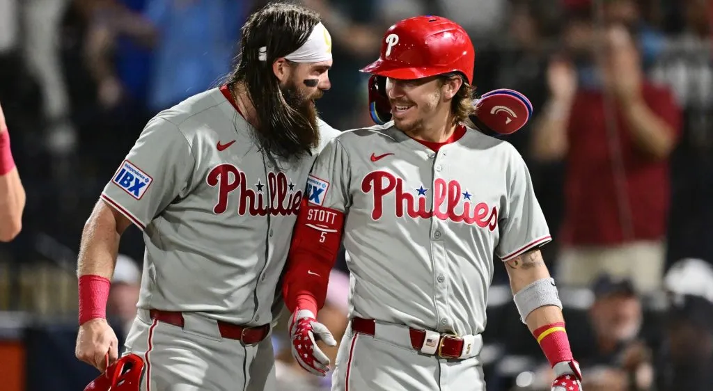 Bryson Stott #5 celebrates with Brandon Marsh #16 of the Philadelphia Phillies after hitting a three-run home run in the eighth inning against the Tampa Bay Rays at George M. Steinbrenner Field on May 08, 2025 in Tampa, Florida. (Photo by Julio Aguilar/Getty Images)