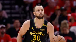 Stephen Curry #30 of the Golden State Warriors brings the ball up court in the second half against the Houston Rockets