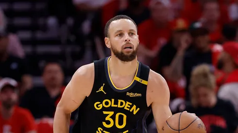Stephen Curry #30 of the Golden State Warriors brings the ball up court in the second half against the Houston Rockets