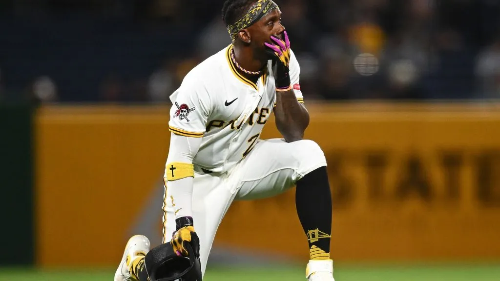 Andrew McCutchen #22 of the Pittsburgh Pirates looks on after a fan fell from the stands