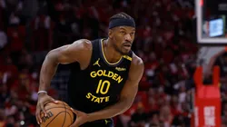 Jimmy Butler III #10 of the Golden State Warriors controls the ball against Amen Thompson #1 of the Houston Rockets