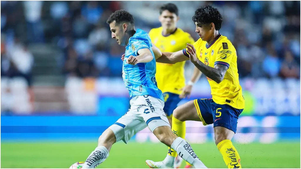 Oussama Idrissi of Pachuca competes for the ball against Kevin Alvarez of America – Manuel Velasquez/Getty Images