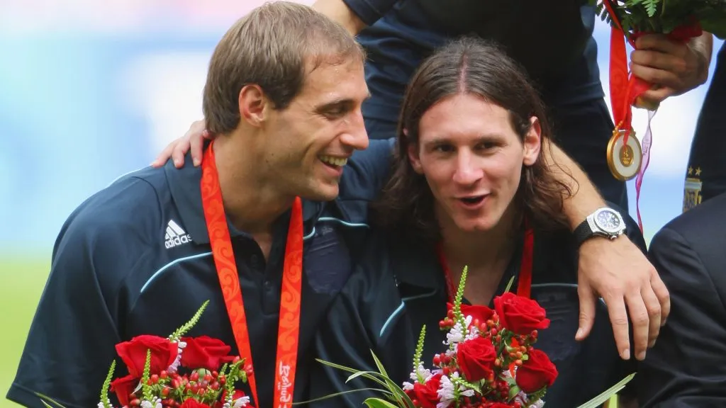 Pablo Zabaleta and Lionel Messi of Argentina celebrate gold during the medal ceremony for the Men’s Soccer in 2008. (Stu Forster/Getty Images)