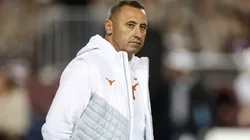 Head coach Steve Sarkisian of the Texas Longhorns watches players warm up before the game against the Texas A&M Aggies at Kyle Field on November 30, 2024 in College Station, Texas.