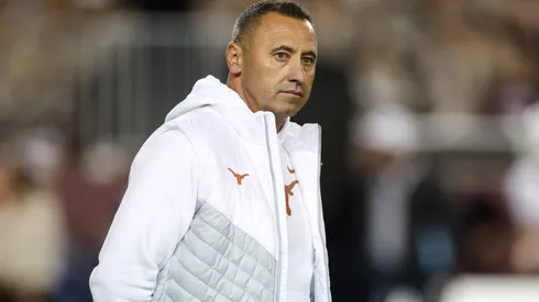 Head coach Steve Sarkisian of the Texas Longhorns watches players warm up before the game against the Texas A&M Aggies at Kyle Field on November 30, 2024 in College Station, Texas.