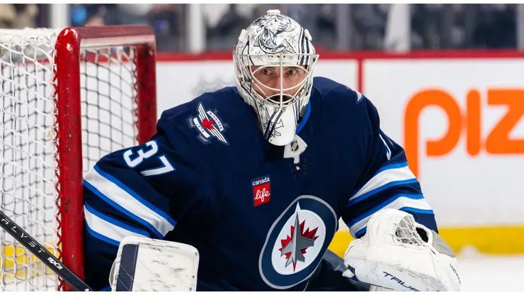 Connor Hellebuyck #37 of the Winnipeg Jets warms up.