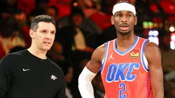 Head coach Mark Daigneault and Shai Gilgeous-Alexander #2 of the Oklahoma City Thunder talk in the second half of a semifinal game of the Emirates NBA Cup against the Houston Rockets at T-Mobile Arena on December 14, 2024 in Las Vegas, Nevada. The Thunder defeated the Rockets 111-96.