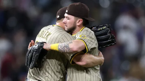 Starting pitcher Stephen Kolek #32 of the San Diego Padres is congratulated by Jackson Merrill #3 after throwing a complete game shutout against the Colorado Rockies at Coors Field on May 10, 2025 in Denver, Colorado.