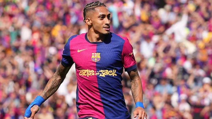 Raphinha of FC Barcelona celebrates scoring his team's third goal with teammate Ferran Torres during the LaLiga match between FC Barcelona and Real Madrid CF at Estadi Olimpic Lluis Companys on May 11, 2025 in Barcelona, Spain.
