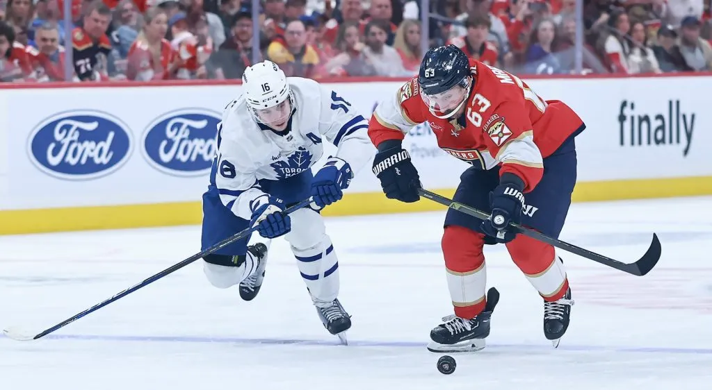 Brad Marchand #63 of the Florida Panthers and Mitch Marner #16 of the Toronto Maple Leafs fight for possession of the puck during the second period in Game Four of the Second Round of the 2025 Stanley Cup Playoffs at Amerant Bank Arena on May 11, 2025 in Sunrise, Florida. (Photo by Carmen Mandato/Getty Images)