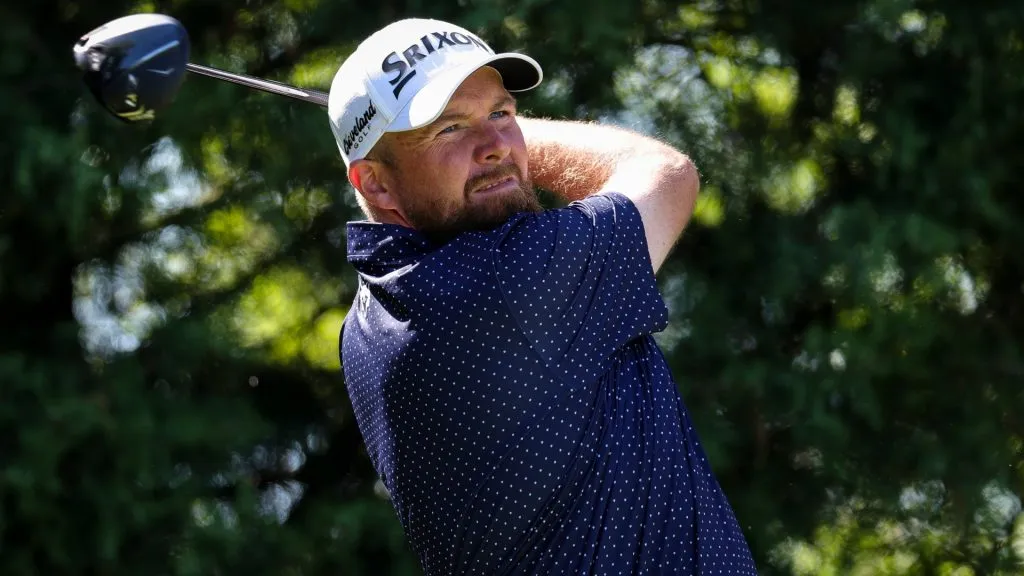 Shane Lowry of Ireland hits a tee shot on the ninth hole during the third round of the Truist Championship 2025 at The Wissahickon at Philadelphia Cricket Club on May 10, 2025. (Source: Andrew Redington/Getty Images)