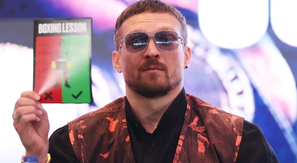 Oleksandr Usyk holds up a ‘Boxing Lesson’ booklet during a press conference ahead of the Undisputed IBF, IBO, WBC and WBO World Heavyweight Titles’ fight between Oleksandr Usyk and Daniel Dubois as part of Undisputed: Usyk v Dubois II at Wembley Stadium on April 29, 2025 in London, England. (Photo by Alex Davidson/Getty Images)