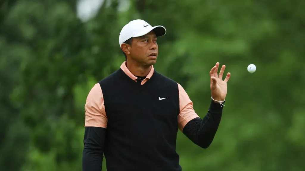 Tiger Woods of the United States catches a ball on the first green during the third round of the 2022 PGA Championship at Southern Hills Country Club on May 21, 2022 in Tulsa, Oklahoma.