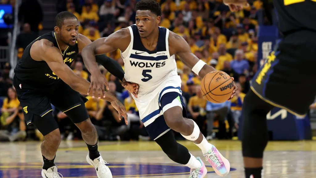 Anthony Edwards #5 of the Minnesota Timberwolves dribbles the ball against Jonathan Kuminga #00 of the Golden State Warriors during Game 4. (Ezra Shaw/Getty Images)