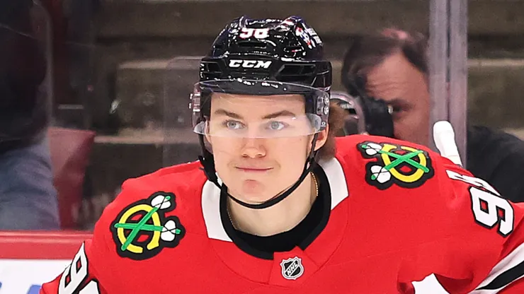 Connor Bedard #98 of the Chicago Blackhawks celebrates after assisting a goal by Tyler Bertuzzi #59 (not pictured) against the New York Rangers during the first period at the United Center on January 05, 2025 in Chicago, Illinois.