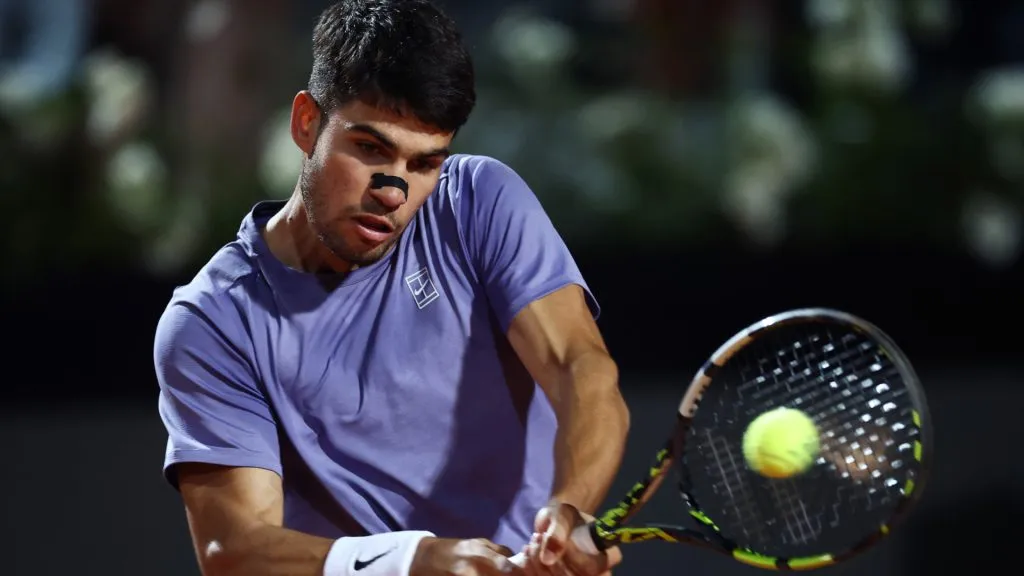 Carlos Alcaraz of Spain plays a backhand against Laslo Djere of Serbia during the third round of the Rome Open. (Dan Istitene/Getty Images)