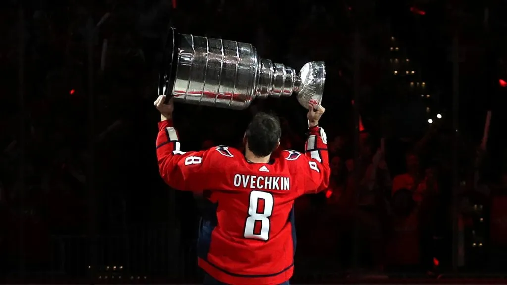 Alex Ovechkin #8 of the Washington Capitals skates with the Stanley Cup prior to watching the 2018 Stanley Cup Championship banner rise to the rafters. (Source: Patrick Smith/Getty Images)