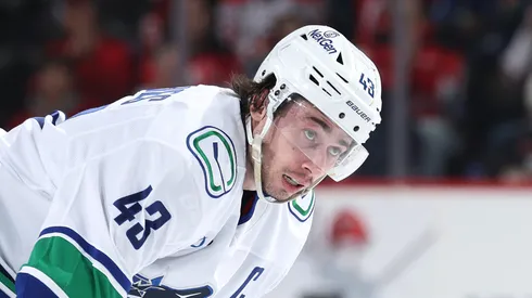 Quinn Hughes #43 of the Vancouver Canucks looks on before a face off against the New Jersey Devils in the third period at Prudential Center on March 24, 2025 in Newark, New Jersey. The Vancouver Canucks defeated the New Jersey Devils 4-3 after an overtime period and a shootout.