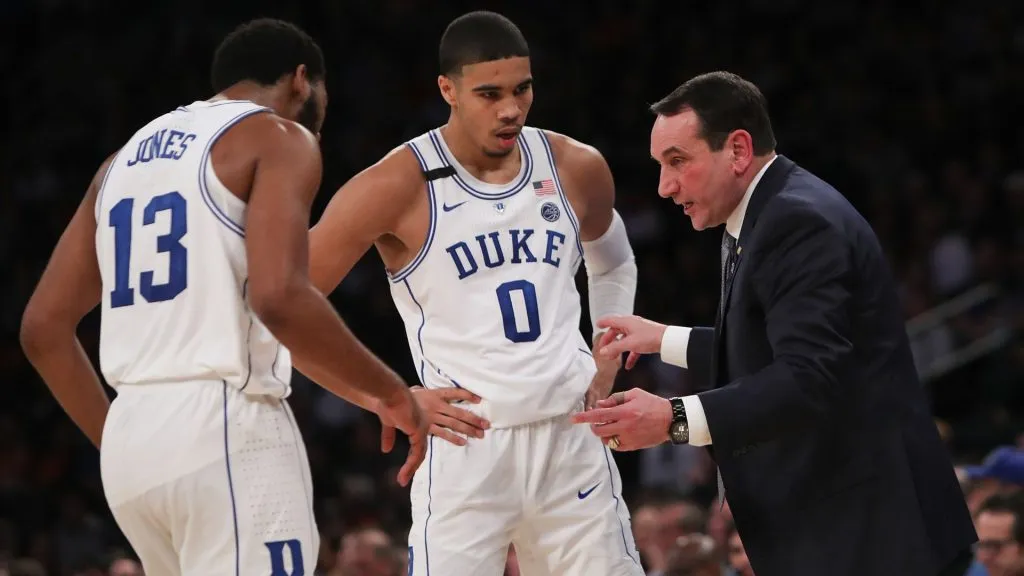Matt Jones #13 and Jayson Tatum #0 of the Duke Blue Devils talk with head coach Mike Krzyzewski on December 6, 2016.
